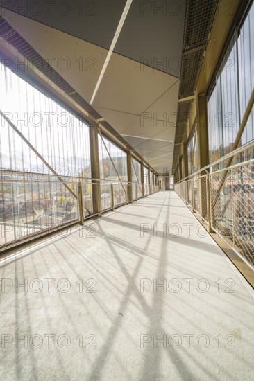 Modern bridge with sunbeams and grid-shaped architecture, spanning a gorge, ZOB Calw, Hermann Hessebahn, Calw, Germany