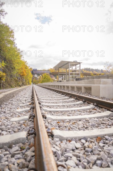 Abandoned tracks with autumn leaves along a platform, ZOB Calw, Hermann Hessebahn, Calw, Germany