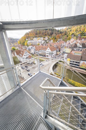 Glass staircase with view of autumnal town and hilly landscape, ZOB Calw, Hermann Hessebahn, Calw, Germany