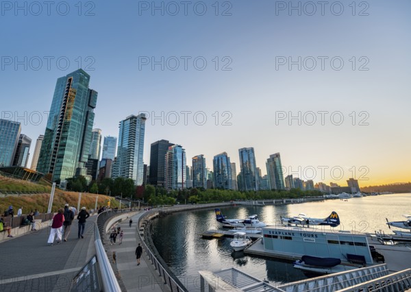 Seaplane Terminal, skyscrapers on the promenade at sunset, Coal Harbour, Vancouver, British Columbia, Canada