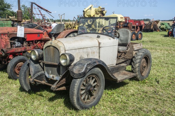 Older automobile converted into agricultural tractor at exhibition on old-fashioned harvest festival in Svenstorp, Ystad municipality, Skåne county, Sweden, Scandinavia