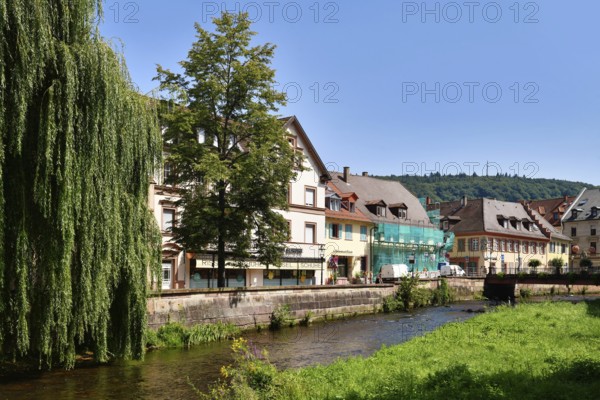 Ettlingen, Germany - August 13th 2025: Alb brook in historic center of Ettlingen, Germany. Small creek with old buildings