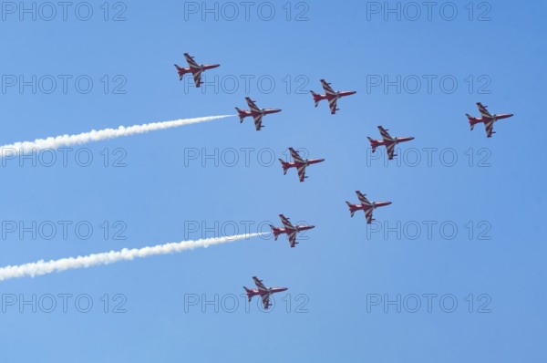 The Indian Air Force (IAF) Surya Kiran aerobatics team performs during an air show as part of the 93rd Air Force Day celebrations on November 8, 2025 in Guwahati, India