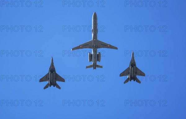 An Indian Air Force Netra AEW&C aircraft flies in formation with two MiG-29 fighter jets during an air show as part of the 93rd Air Force Day celebrations on November 8, 2025 in Guwahati, India