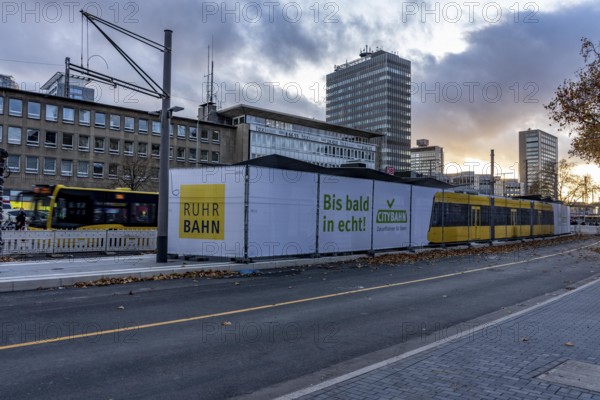 Construction site of the stop at the main train station, for the new city railway, visualization of the full-size tram, a new tram line over 5 km long, which will connect the west of Essen, the new district 51, with the city center, from 2026, Essen, North Rhine-Westphalia, Germany