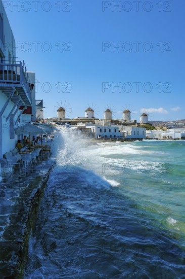 Mykonos, Cyclades, Greece - The six sixteenth-century windmills, lined up on a hill above Mykonos Town, Mykonos Chora, are the island's landmark. Mykonos is part of the Cyclades archipelago in the Aegean Sea