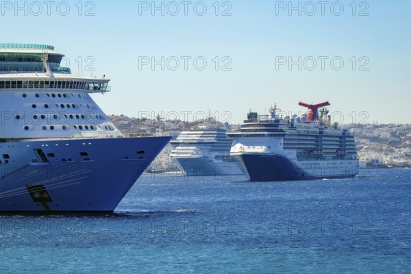Mykonos, Cyclades, Greece - Cruise ships are moored in the harbour bay, Mykonos New Port, in front of the old town of Mykonos Town