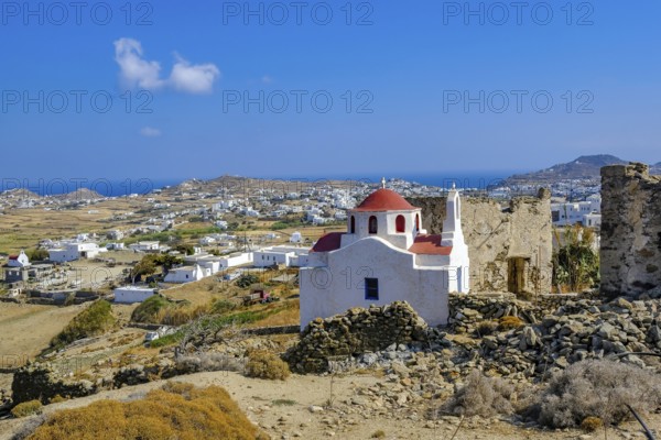 Ano Mera, Mykonos, Cyclades, Greece - Small church from the 18th century on the site of the Gyzi ruins, 13th century castle ruins by the Venetian Gyzi family, right next to the Paleokastro monastery in the interior of the island just outside Ano Mera, is now a tourist attraction much visited by tourists