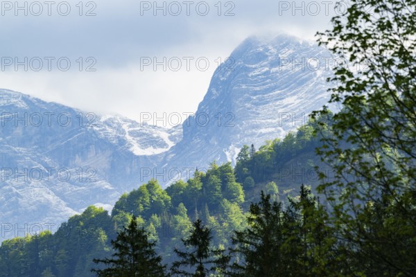 View into the mountains next to Lake Almsee on a rainy day in spring, Traunstein summit, Traunkirchen, Salzkammergut, Austria