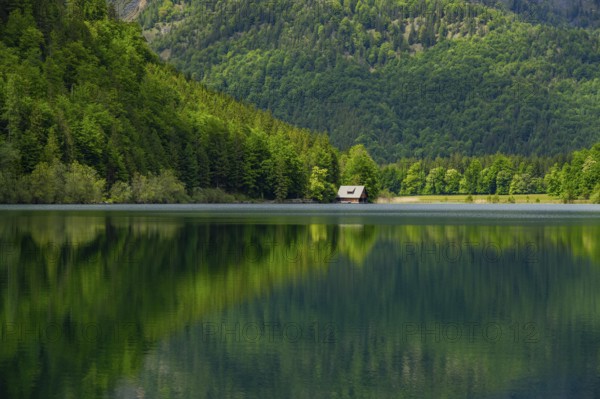 Landscape of Lake Offensee after rain when the sun comes through the clouds in spring, Salzkammergut, Austria