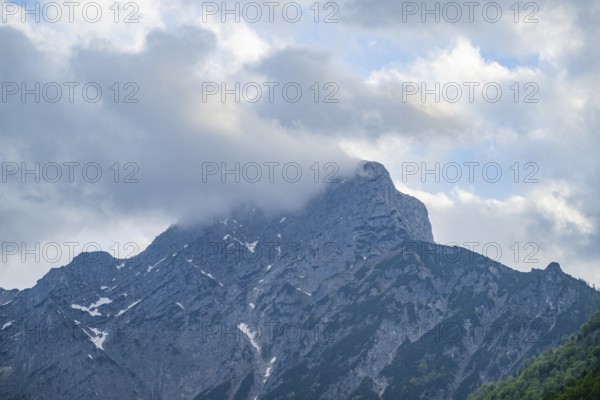 View into the mountains next to Lake Traunsee on a rainy day in spring, Traunstein summit, Traunkirchen, Salzkammergut, Austria