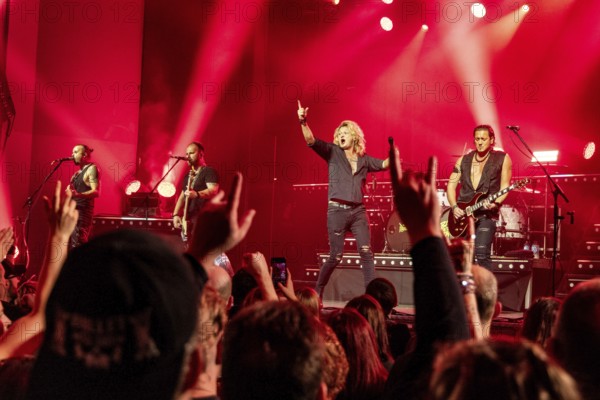Ande Braun (guitarist), Steffen Haile (bassist), Hannes Braun (singer) and Jim Müller (guitarist) of the band Kissin' Dynamite live on Back with a Bang World Tour at Capitol Hannover on 09.11.2025
