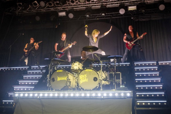 Ande Braun (guitarist), Steffen Haile (bassist), Sebastian Berg (drummer), Hannes Braun (singer) and Jim Müller (guitarist) of the band Kissin' Dynamite live on Back with a Bang World Tour at Capitol Hannover on 09.11.2025