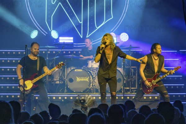 Steffen Haile (bassist), Sebastian Berg (drummer), Hannes Braun (singer) and Jim Müller (guitarist) of the band Kissin' Dynamite live on Back with a Bang World Tour at Capitol Hannover on 09.11.2025