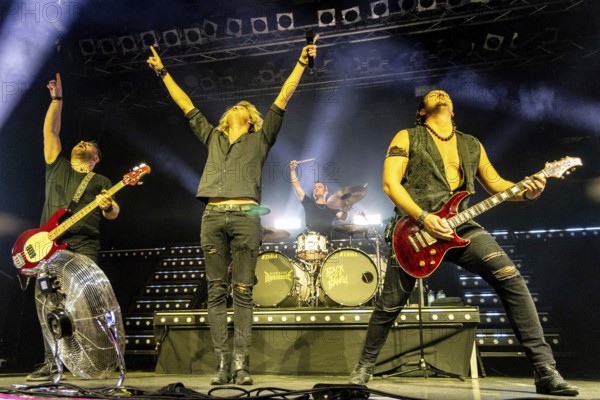 Steffen Haile (bassist), Hannes Braun (singer), Sebastian Berg (drummer) and Jim Müller (guitarist) of the band Kissin' Dynamite live on Back with a Bang World Tour at Capitol Hannover on 09.11.2025