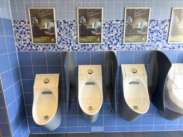 Recruitment for the Bundeswehr, in a motorway toilet above the urinals in the men's toilet, Lower Saxony, Germany