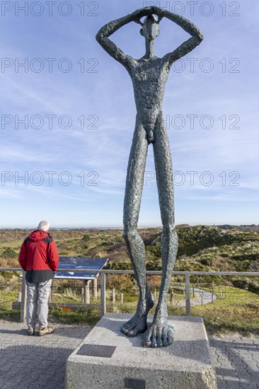 North Sea, Spiekeroog island, autumn, dune landscape, viewing dune, bronze sculpture 'De Utkieker by artist Hannes Helmke, East Frisian Islands, Lower Saxony, Germany