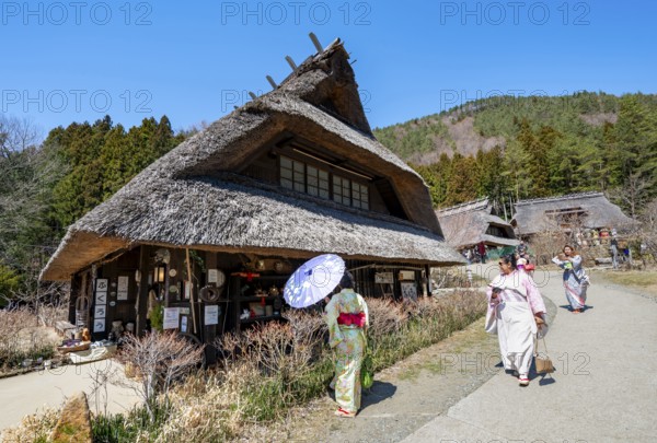 Visitors in kimono, Iyashinosato open-air museum, old Japanese village with traditional houses, Fujikawaguchiko, Saiko, Japan