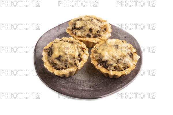 Tartlets with meat and cheese isolated on white background. side view, copy space