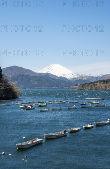 Attached rowing boats, view of Lake Ashi with Mount Fuji volcano, Hakone, Japan