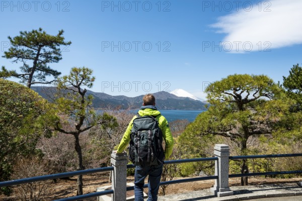 Tourist enjoying the view, Benten-no-hana Tenbodai viewpoint, Hakone Park, view of Lake Ashi with Mount Fuji volcano, Hakone, Japan