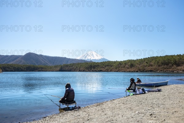 Anglers at Lake Saiko, behind volcano Mt. Fuji, Minamitsuru District, Yamanashi Prefecture, Japan
