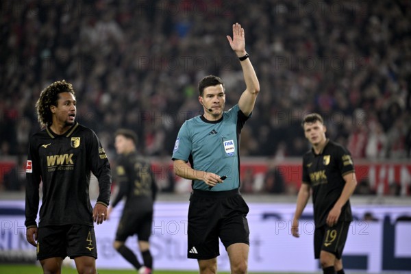 Referee Harm Osmer's gesture gesture Han-Noah Massengo FC Augsburg FCA (04) Robin Fellhauer FC Augsburg FCA (19) Elias Saad FC Augsburg FCA (26) MHPArena, MHP Arena Stuttgart, Baden-Württemberg, Germany