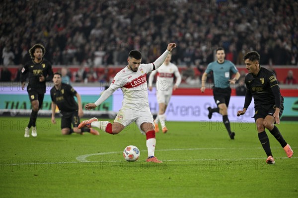 Action goal goal Deniz Undav VfB Stuttgart (26) shoots Dimitrios Giannoulis FC Augsburg FCA (13) behind referee Harm Osmers MHPArena, MHP Arena Stuttgart, Baden-Württemberg, Germany