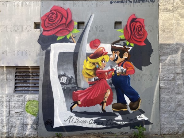 Street art mural in Buenos Aires with a comic couple dancing tango and the inscription mi buenos aires querido, my beloved Buenos Aires, Argentina