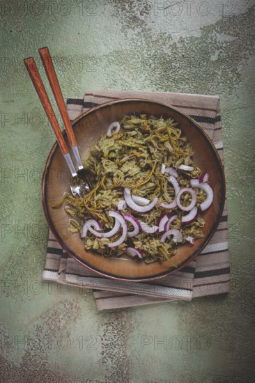 Jonjoli, Colchian klekachka, jonjoli salad, with red onion and butter, Georgian appetizer, pickled jonjoli, no people