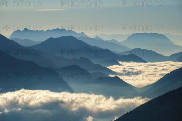 Blue-colored silhouette of mountains, fog in the valley, Wilder Kaiser and Chiemgau Alps, Upper Bavaria, Bavaria, Germany