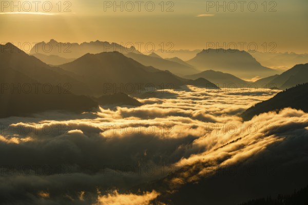 Silhouette of mountains at dusk, fog in the valley, Wilder Kaiser and Chiemgau Alps, Upper Bavaria, Bavaria, Germany