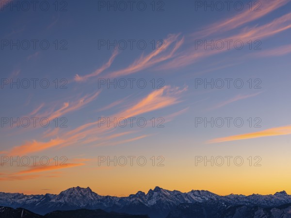 Red-colored plume clouds over the Berchtesgaden Alps at dusk, Hochstaufen, Chiemgau Alps, Upper Bavaria, Bavaria, Germany