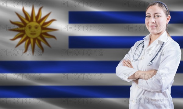 Female doctor on Uruguay flag. Doctor with crossed arms on Uruguay flag. Uruguay health and care concept