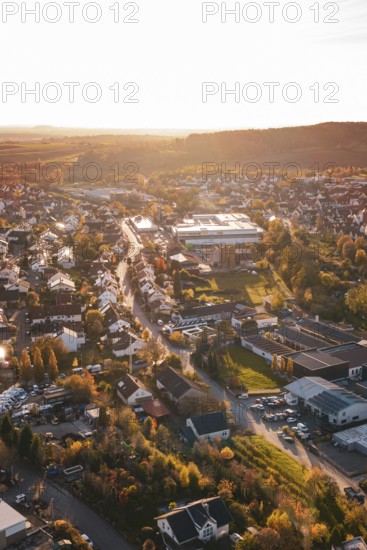 Aerial view of a village at sunset with roads and houses, Großbottwar, Germany