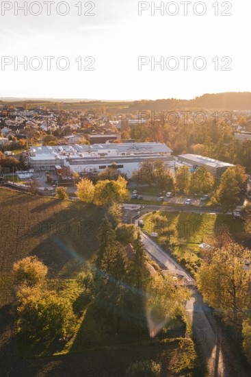 Urban landscape at sunset with autumn trees and golden light, Großbottwar, Germany