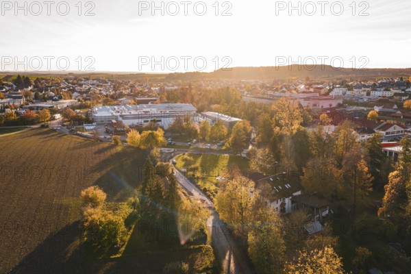 Landscape view at sunset with trees and urban buildings in autumn, Großbottwar, Germany