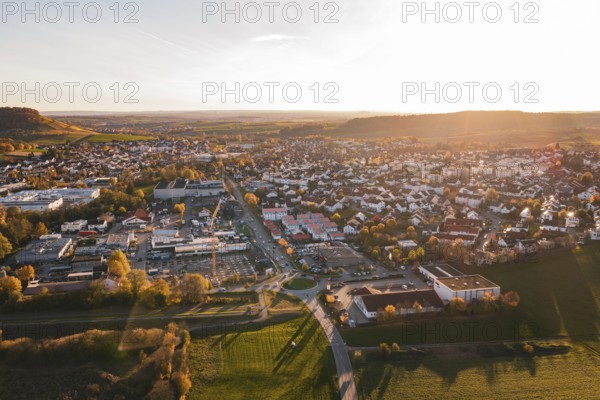 Urban environment in autumn viewed from the air during sunset, Großbottwar, Germany
