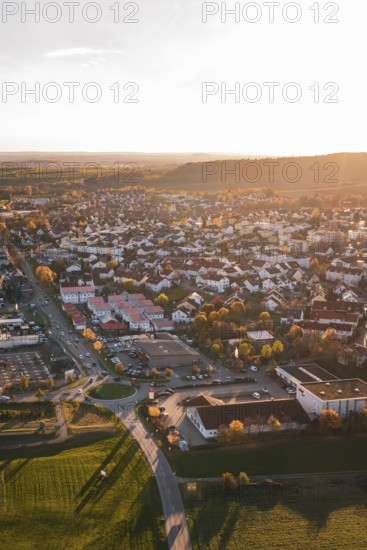 Autumn city view at sunset with roads and numerous buildings, Großbottwar, Germany