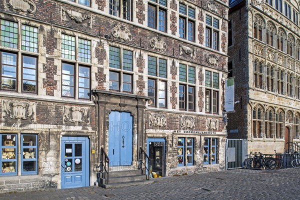 Façade of 17th century baroque guildhall Korenmetershuis at the Graslei in the city Ghent, East Flanders, Belgium