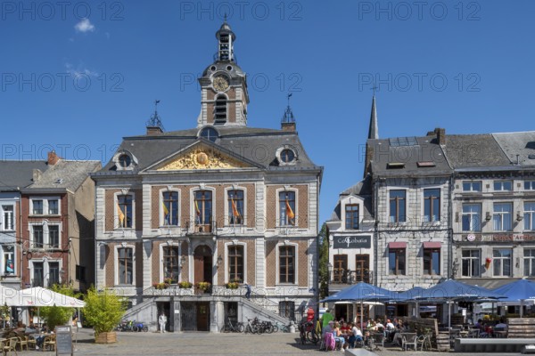 Pavement cafés and 18th century town hall at the Grand Place in the city Huy in summer, province of Liège, Wallonia, Belgium