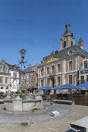 Li Bassinia, 15th century fountain and 18th century town hall at the Grand Place in the city Huy in summer, province of Liège, Wallonia, Belgium