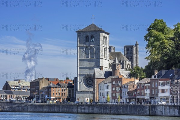 16th century Gothic Notre-Dame collegiate church along the Meuse river in the city Huy, province of Liège, Belgium