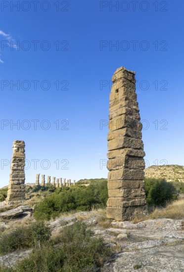 Stone columns of ancient aqueduct, Roman site of Los Banales, near Layana, Zaragoza province, Aragon, Spain