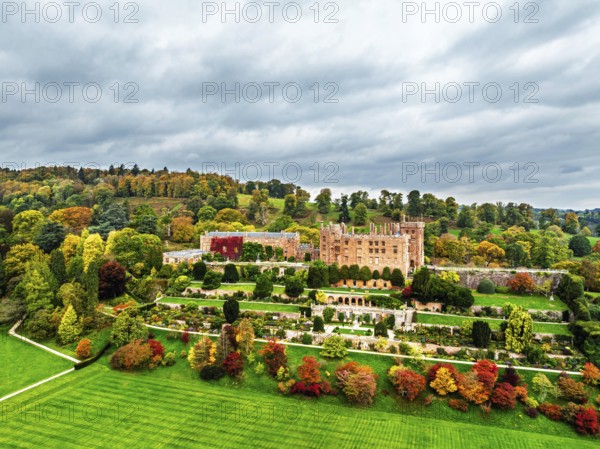 Autumn colours over Powis Castle and Garden from drone, Welshpool, Powys, Wales, England, United Kingdom