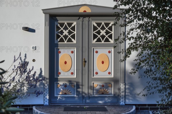 Artistically designed front door of a residential building, Ahrenshoop, Darß, Mecklenburg-Western Pomerania, Germany