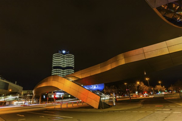 Federally illuminated BMW world, Petuelring, the BMW headquarters office tower in the back, Munich, Upper Bavaria, Bavaria, Germany