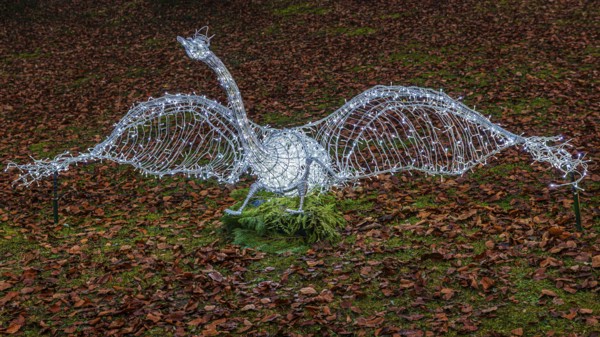 Swan made of wire and fairy lights, on leafy meadow, Historisches Hotel La Villa, Niederpöcking, Upper Bavaria, Bavaria, Germany