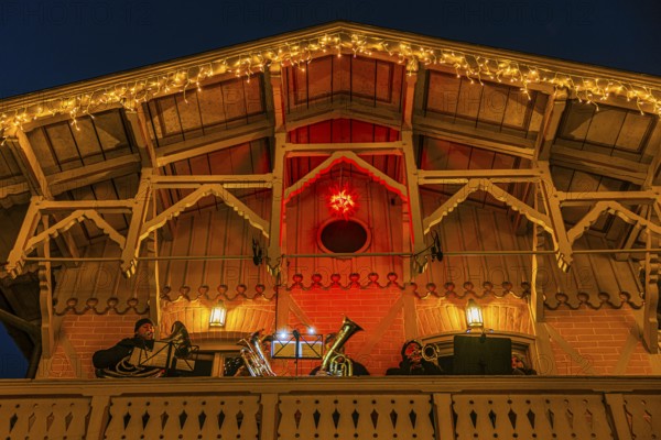 Brass band playing Christmas music on a balcony, Christkindlmarkt, Historisches Hotel La Villa, Starnberger See, Niederpöcking, Upper Bavaria, Bavaria, Germany