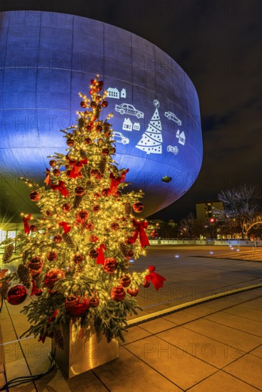 Illuminated Christmas tree with red balls in front of the BMW Museum, BMW World, Petuelring, Munich, Upper Bavaria, Bavaria, Germany
